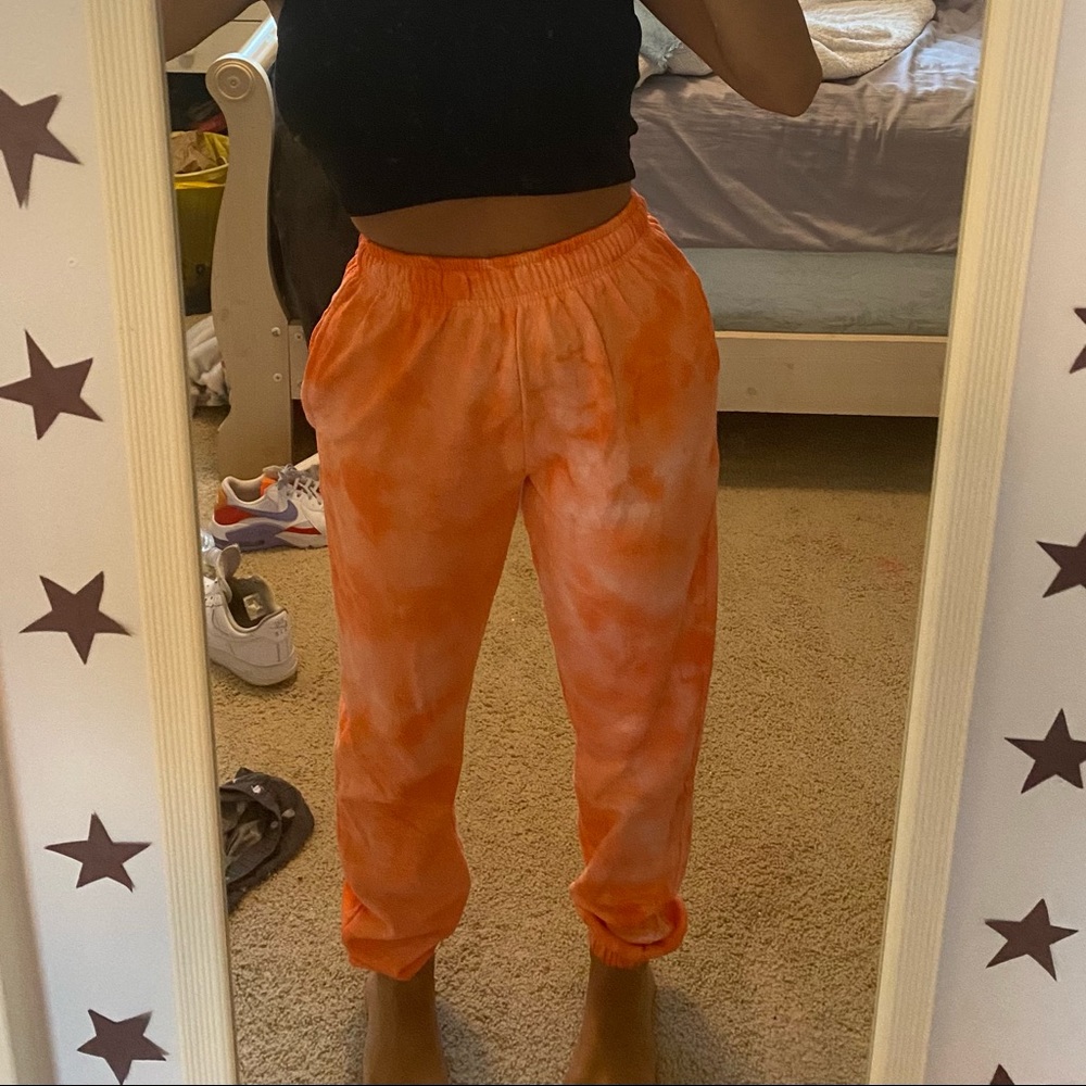 PrettyLittleThing orange tie-dye sweatpants.